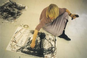 'Client in therapy drawing with the non-dominant hand (normally she is lefthanded) and holding a peice of clay in her left hand for support in feelings / Finland'. 